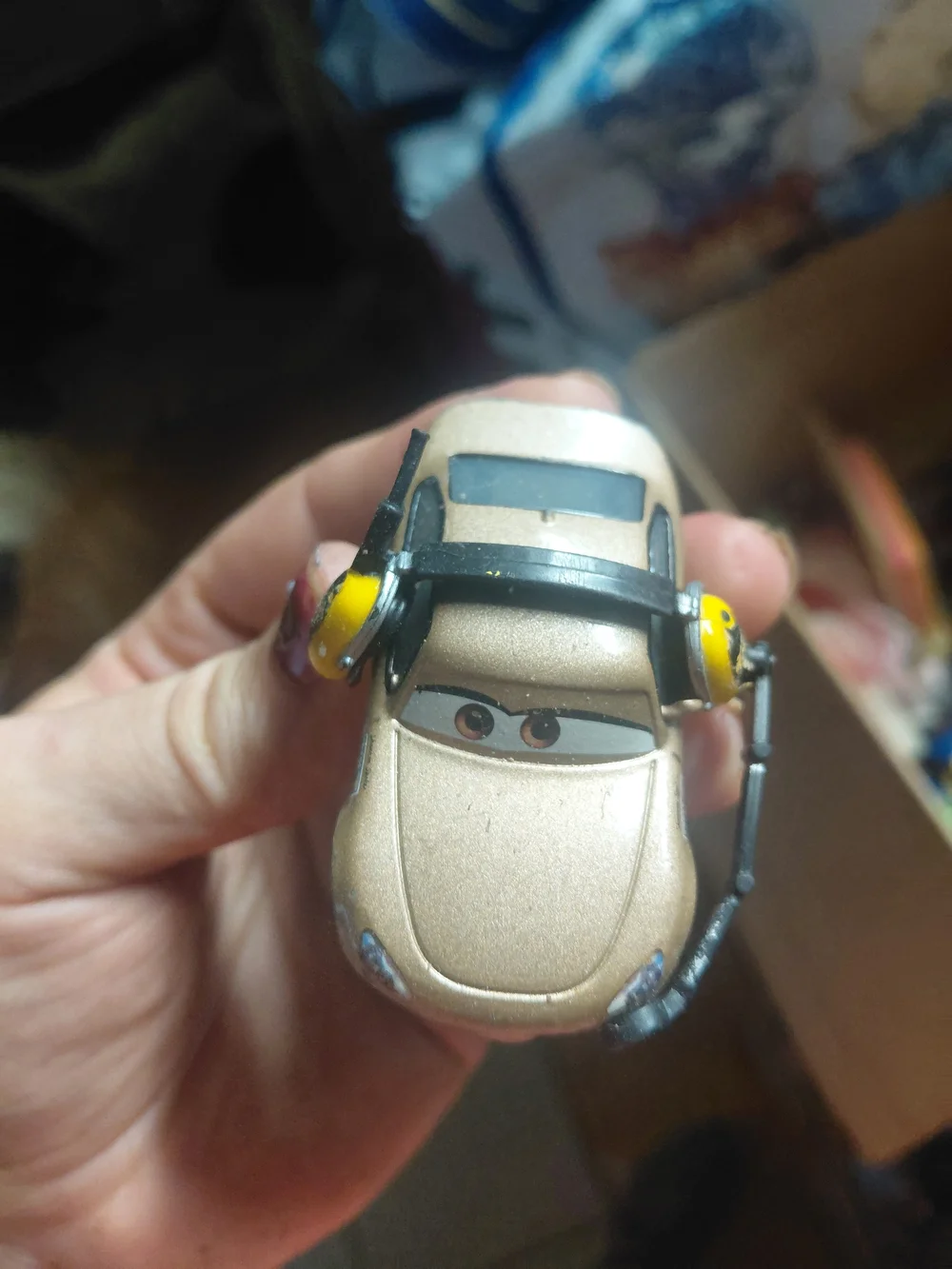 diecast toy is a 1:55 scale Mattel Disney Pixar Cars character named Shannon Spo